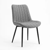 [Grey] Kyvon grey upholstered fabric vertical dining chair angled view with black metal legs