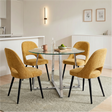 [Mustard | Clear] Kyvon round glass dining set with 110cm round table, chrome legs and 4 mustard chairs in a dining room