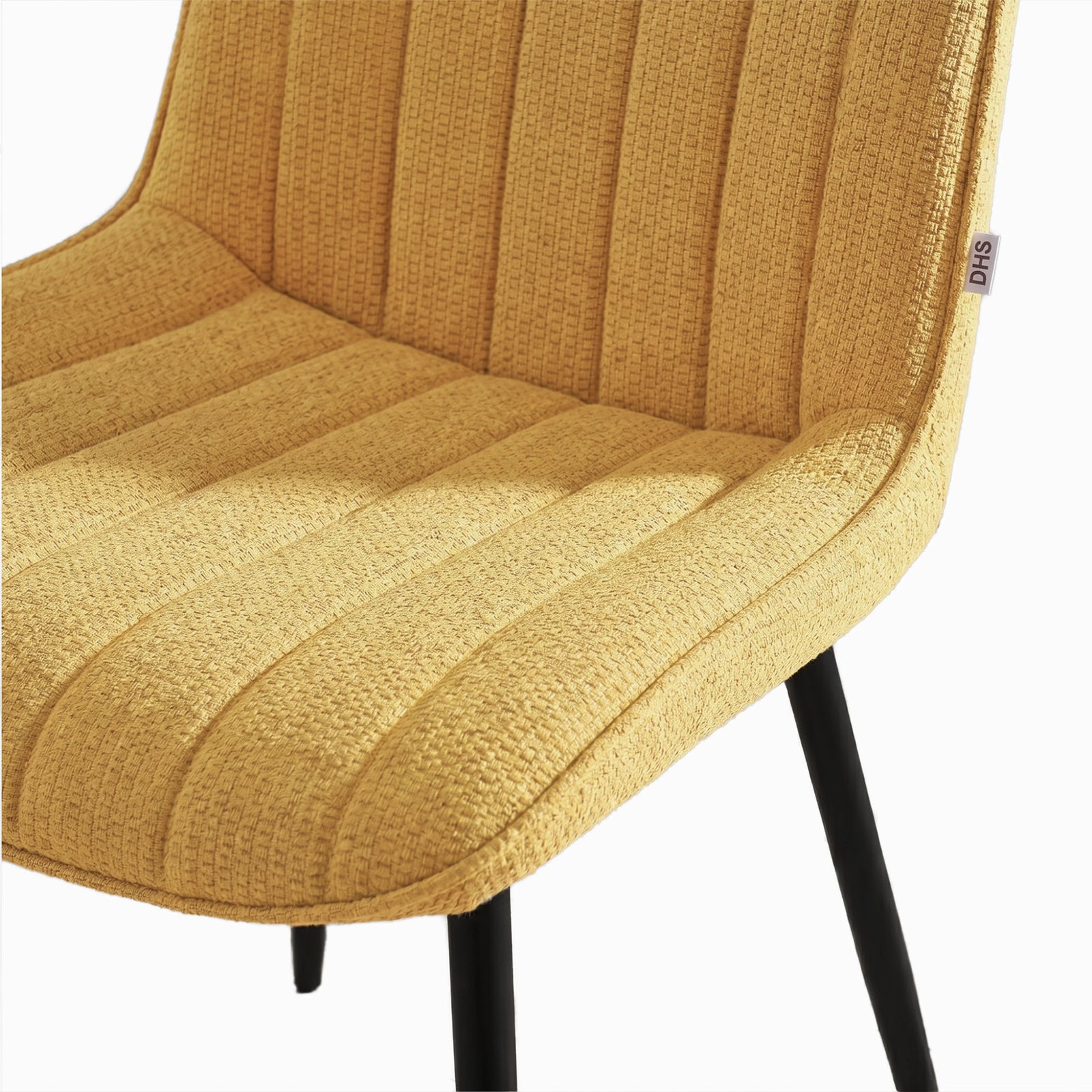 [Mustard] Kyvon close-up of mustard upholstered fabric vertical chair seat with black metal legs