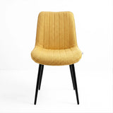 [Vertical Mustard | Clear] Kyvon mustard upholstered fabric channeled stitched dining chair front view with black metal legs