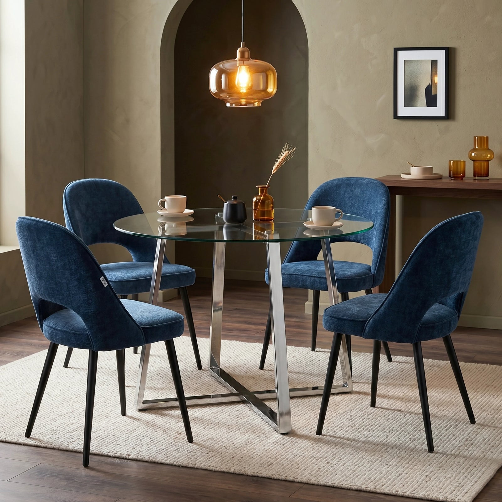 [Blue] Kyvon round glass dining table set with comfy curvy chairs and chrome-finish iron legs in dining room