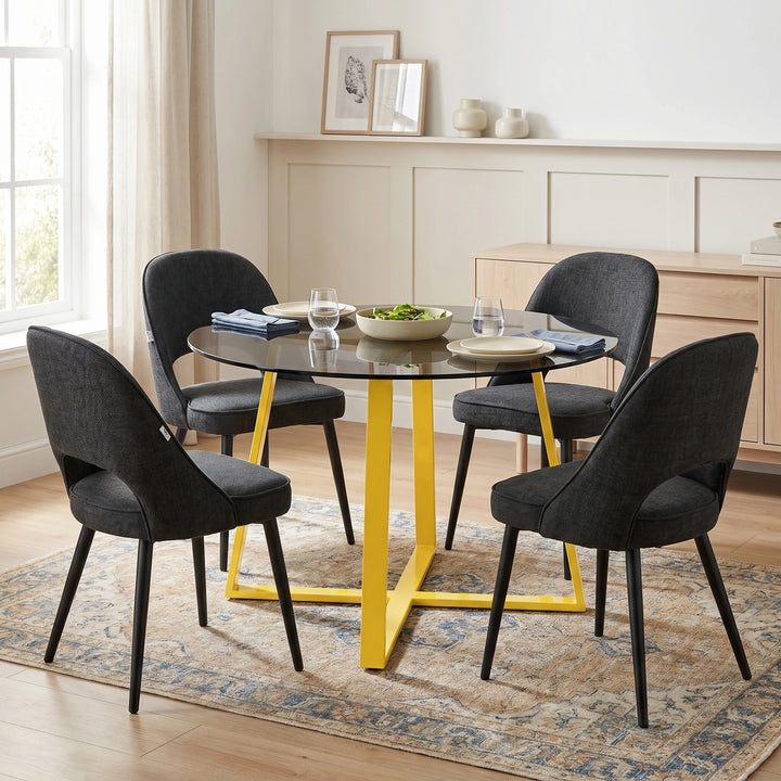 [Black | Tinted] Kyvon smoked round glass dining table set with 4 comfy curvy chairs and golden iron legs in dining room