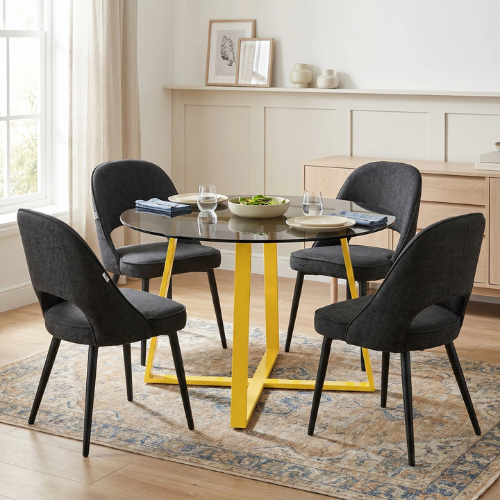 [Black | Tinted] Kyvon smoked round glass dining table set with 4 comfy curvy chairs and golden iron legs in dining room