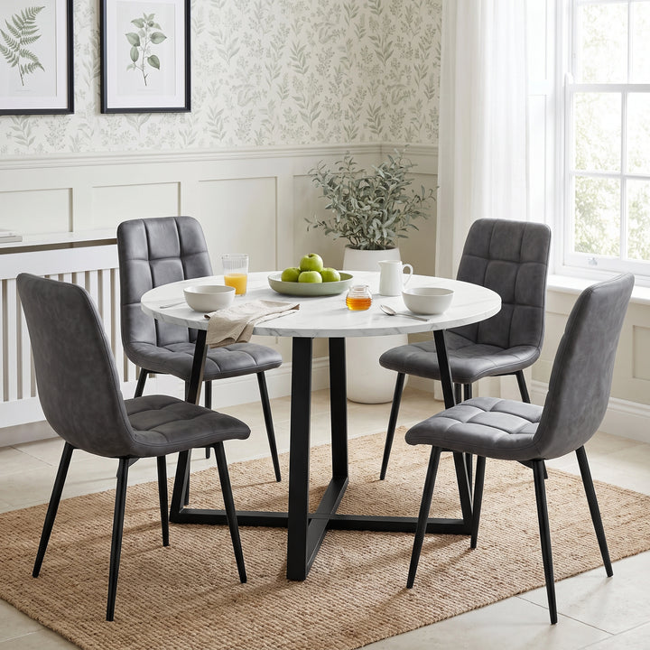 [Grey | White Marble] Kyvon round dining table set with 4 grey suede chairs in a styled room
