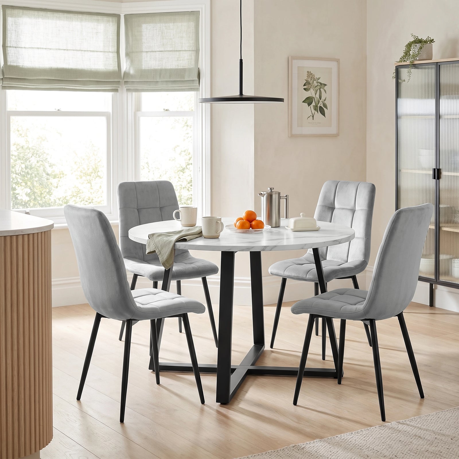 [Light Grey | White Marble] Kyvon round dining table set with 4 light grey velvet chairs in a dining room