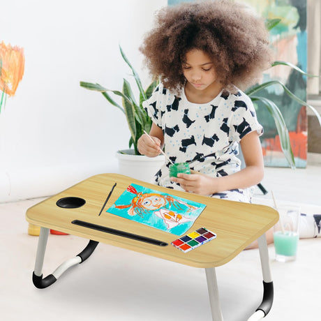 Wooden laptop bed table, offering a convenient and comfortable workspace while relaxing in bed.