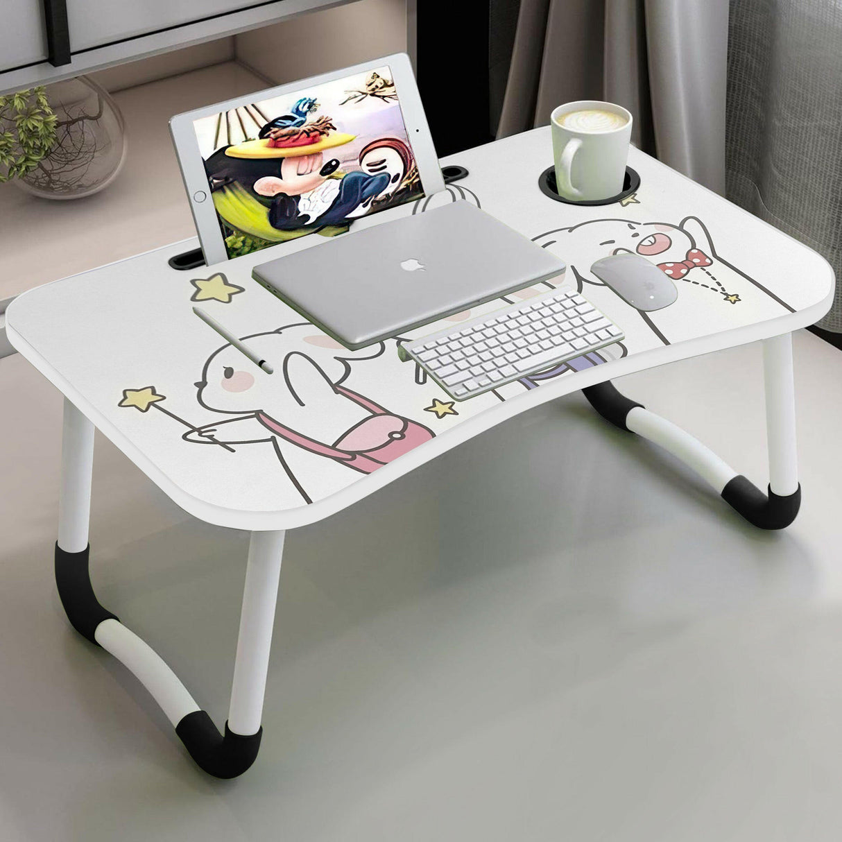 Portable laptop computer table with foldable legs, featuring a cute cartoon design.