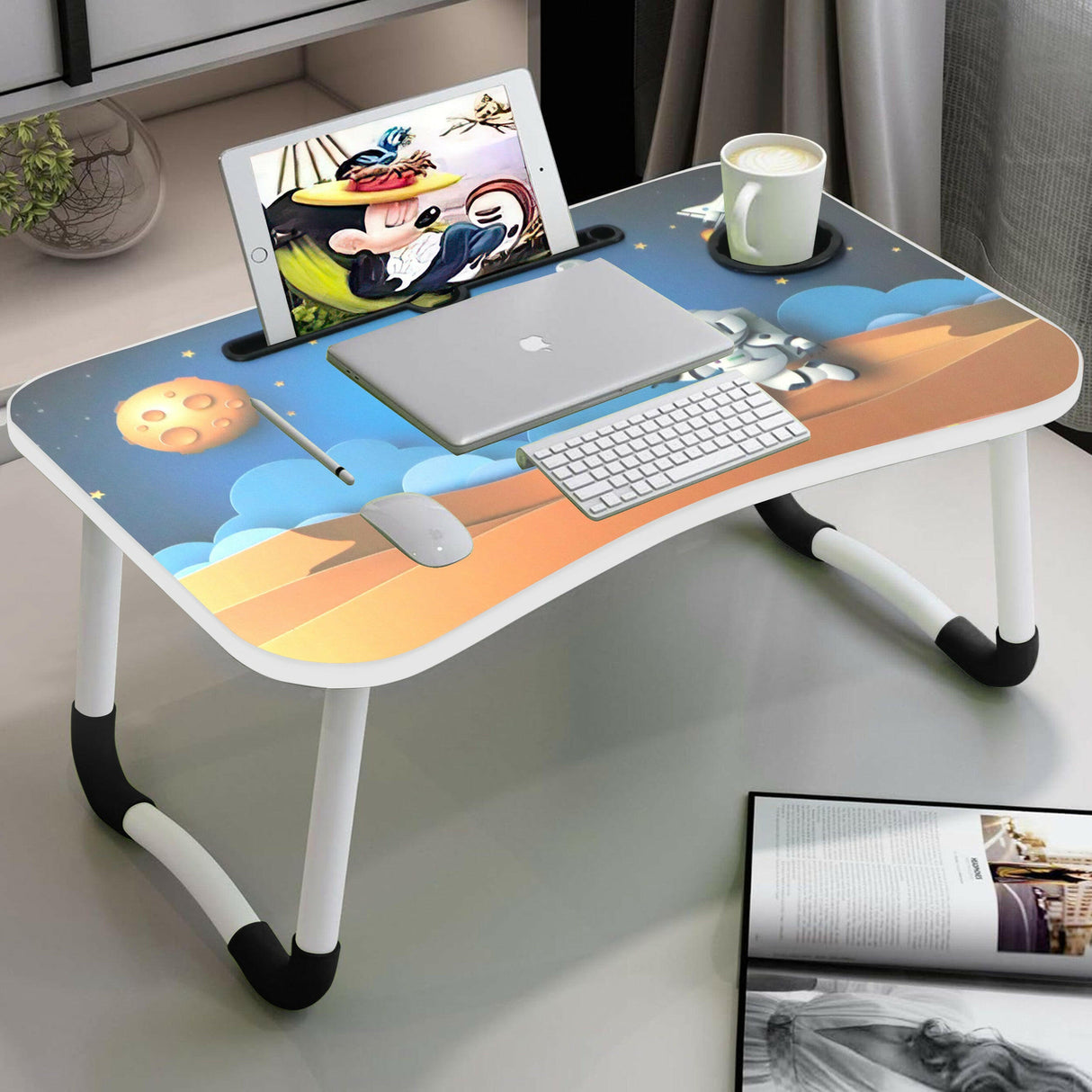 Laptop table foldable with an astronaut-themed design, featuring a built-in tablet slot