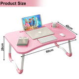 Pink laptop table with ergonomic design, foldable legs, and compact dimensions.