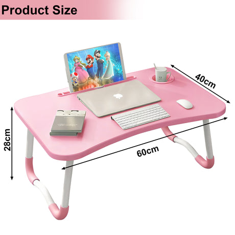 Pink laptop table with ergonomic design, foldable legs, and compact dimensions.