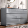 Gray high-gloss dresser with decorative items in a bedroom setting