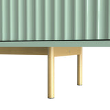 Large green TV unit with wide top, fluted doors, and golden legs, providing elevated storage for modern lounges.