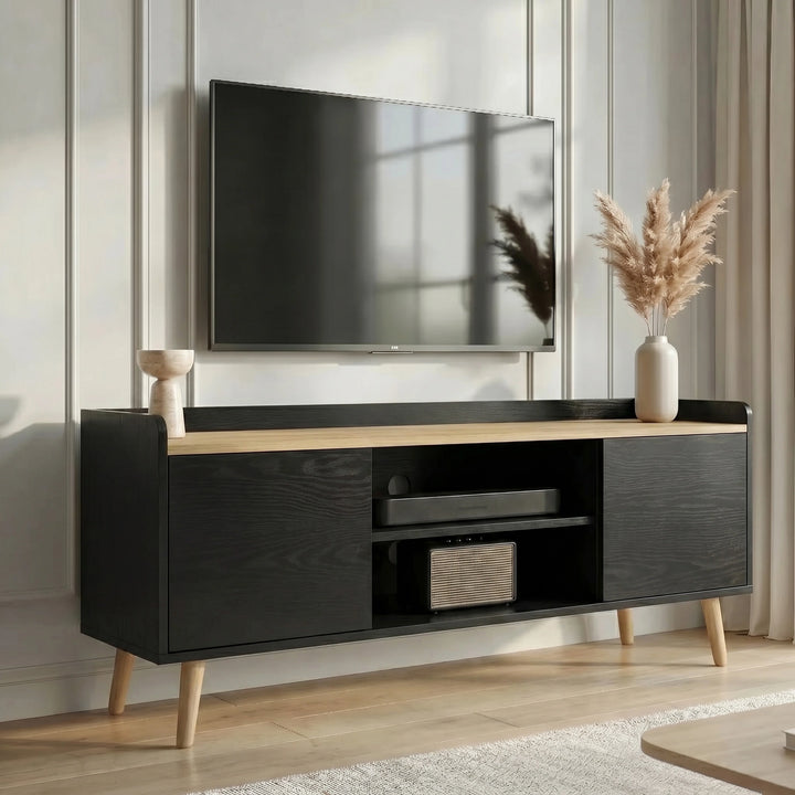 [Black | 112 cm] Larvik Black TV Unit Cabinet with Storage 112cm Oak Top positioned underneath a wall-mounted flat-screen television in a modern living room featuring elegant white wall paneling