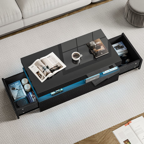 Black coffee table with open drawers in a living room setting
