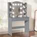 Gray vanity desk with mirror and lights in a room setting