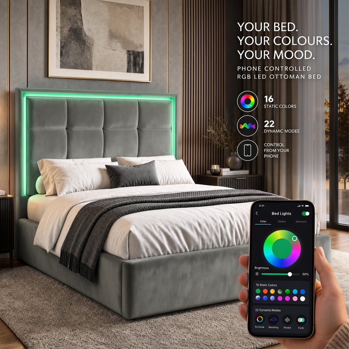 [Grey | King] bedroom scene shows a grey upholstered bed with a glowing LED headboard and a hand holding a smartphone that displays the app controlling the bed lights.