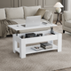 White lift top coffee table with storage shelf for modern living room decor.