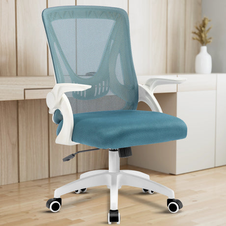 A light blue mesh chair enhances a home office, with a working desk in the backdrop providing a productive vibe.