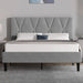 Gray upholstered bed with tufted headboard in a bedroom setting