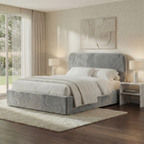 Angled room view of light grey velvet double ottoman storage bed, highlighting padded headboard and frame