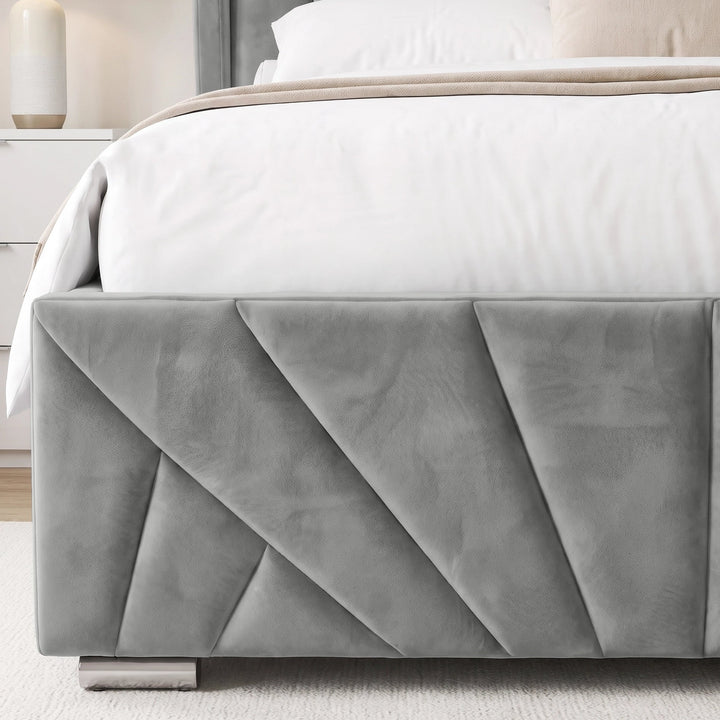 [Double | Grey] upholstered bed frame with geometric sunrise design panelling, dressed in white bedding and a beige throw blanket, in a modern bedroom setting.