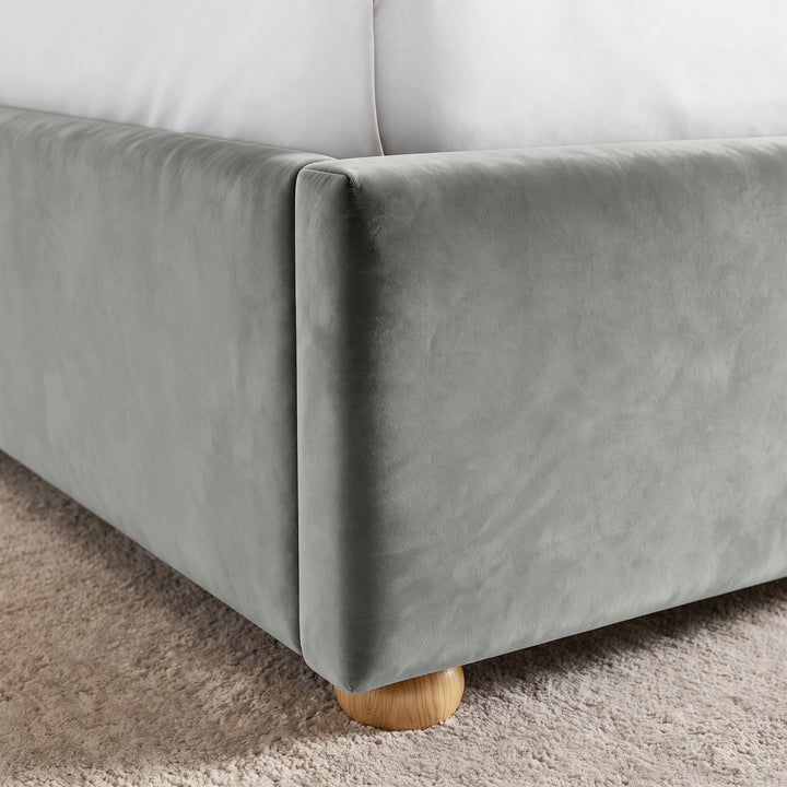 [Double | Light Grey] Close-up of upholstered footboard corner, side rail seam, velvet surface and rounded wooden foot