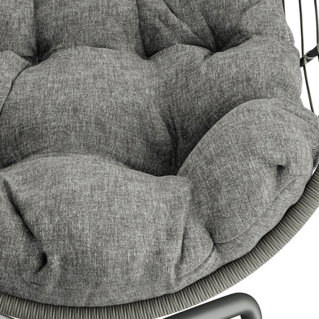 Light grey hanging egg chair with soft cushion, perfect for outdoor relaxation.