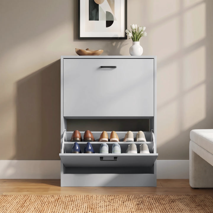 [Light Grey] Front hallway view with lower pull-down drawer open, shoes inside, wall art, vase, bowl, and bench edge