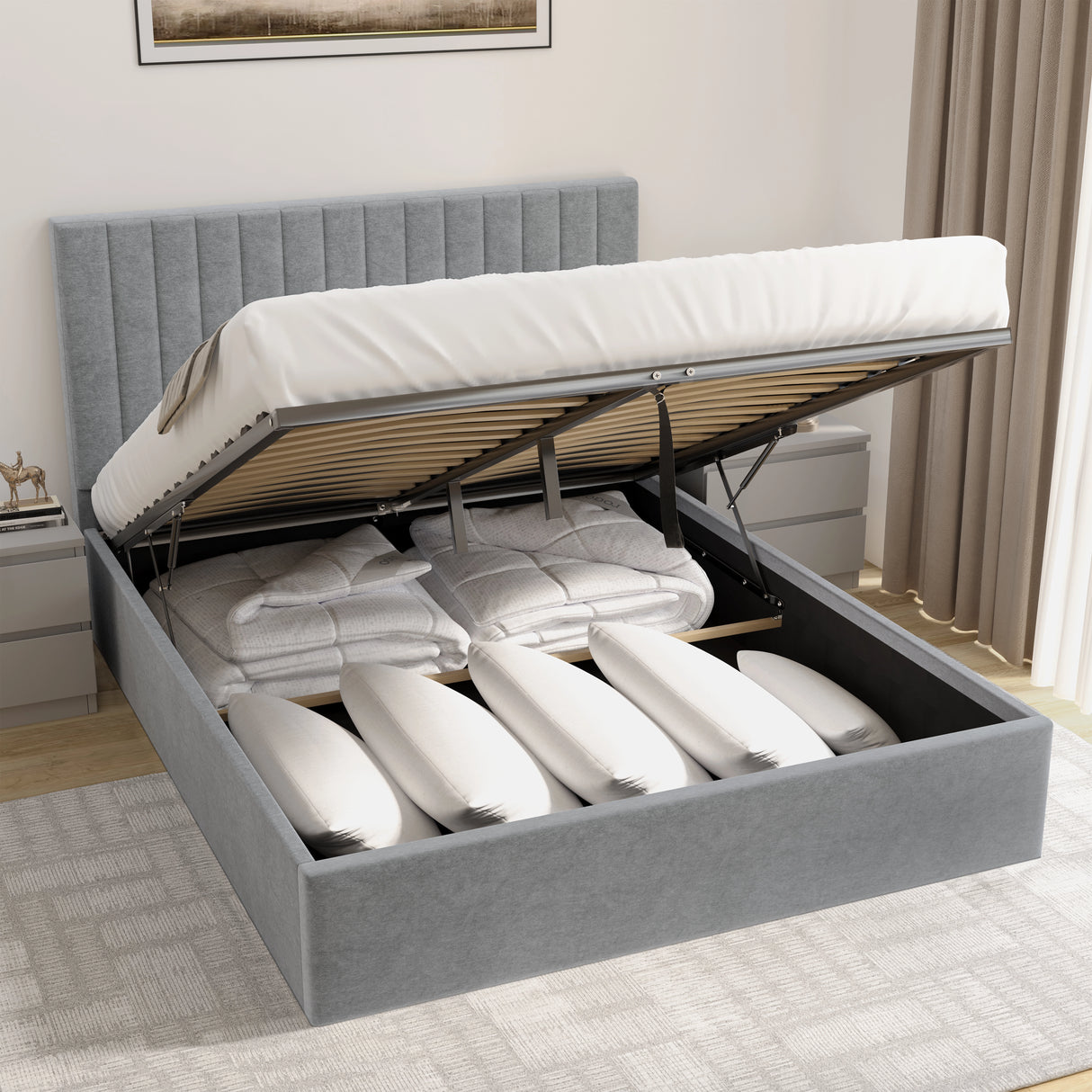 Grey upholstered bed with storage drawers open in a bedroom setting