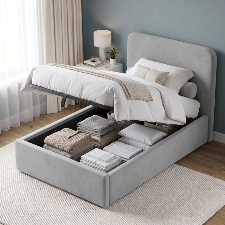 [Light Grey | Small Double] upholstered bed frame with a raised headboard and open storage base, shown in a styled bedroom