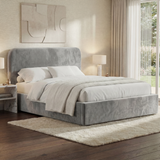 Light grey velvet double ottoman storage bed shown in a bright interior with padded headboard and upholstered base