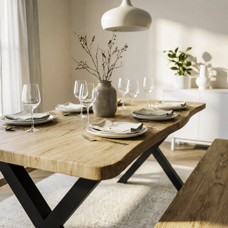 [Light Oak] Crosswick Dining Table with Benches set with wine glasses, dinnerware, linen napkins, vase of branches, and pendant lamp above
