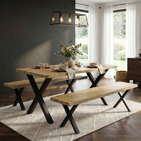 [Light Oak] Crosswick Dining Table with Benches styled in a dark-walled dining room with eucalyptus centrepiece, place settings, and industrial pendant lighting