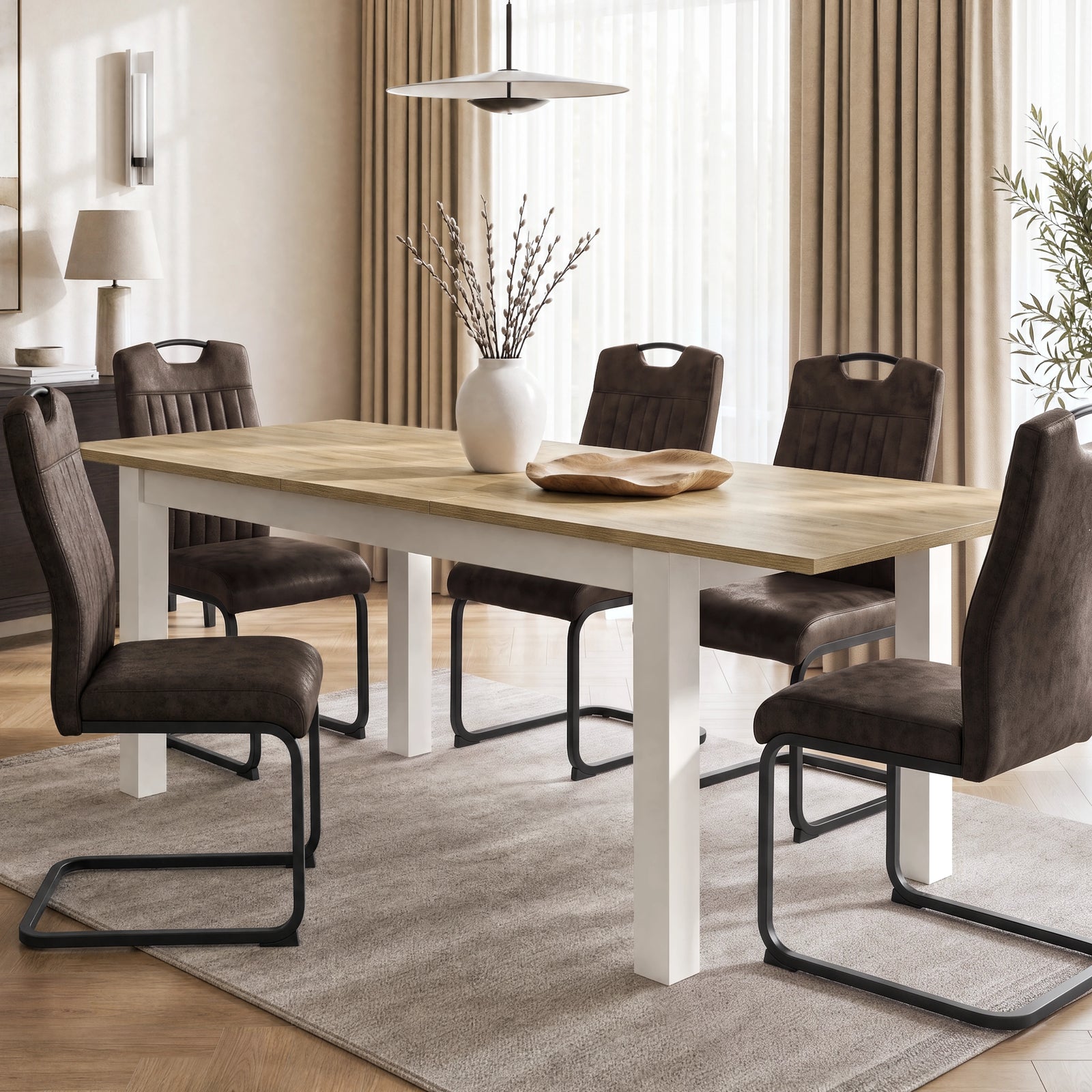 [160cm | Light Oak] Extended 200cm dining table with six brown chairs, Light Oak-effect top, white frame, vase and bowl.