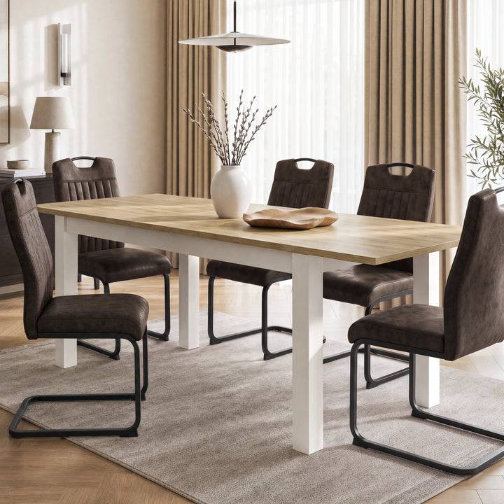 [160 cm | Light Oak] Extended 200cm dining table with six brown chairs, Light Oak-effect top, white frame, vase and bowl.