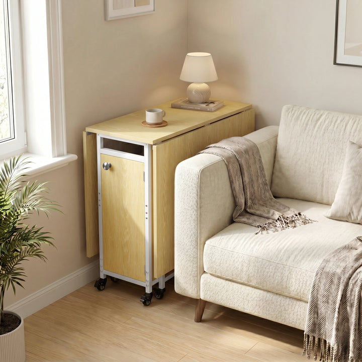 [Light Oak] Kitchen & Dining Furniture Sets folded side table beside a sofa with lamp, cup, blanket, and window light.