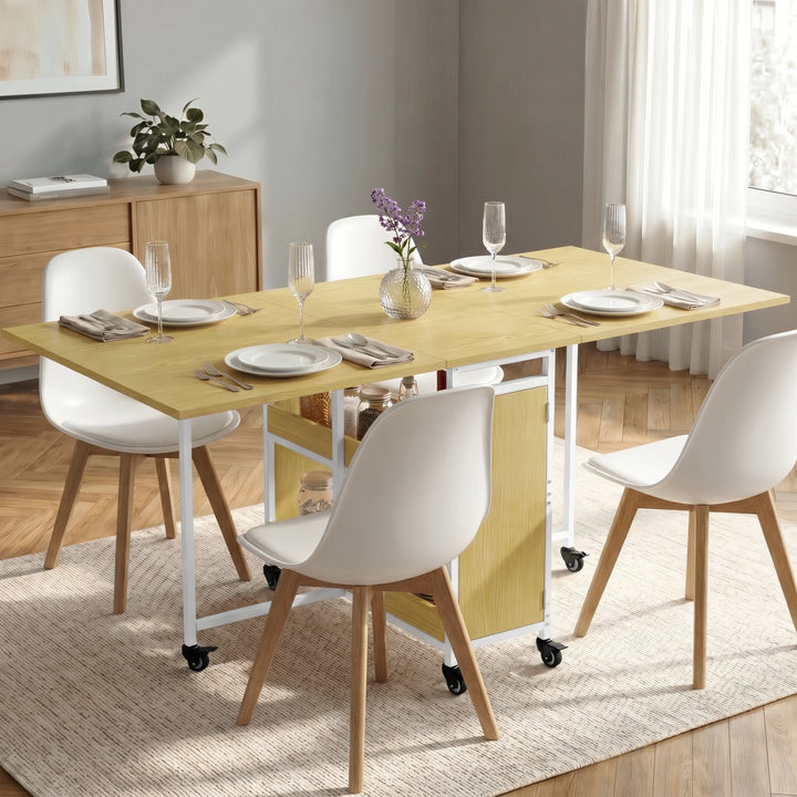 [Light Oak] Stovra dining scene with pale oak table surface, white frame, side cupboard, shelves, and casters