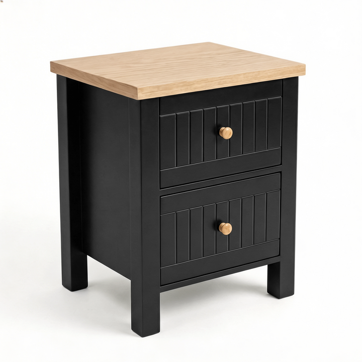 [Black] Three-quarter Linra bedside table view on white showing the oak top, two grooved drawers and square legs