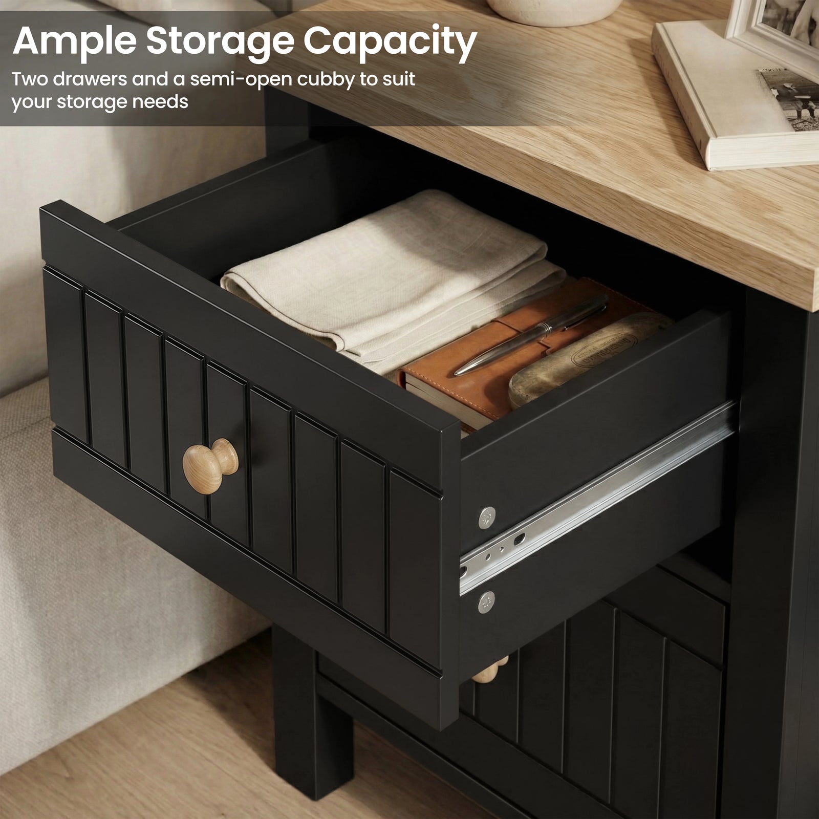 [Black] Two-drawer Linra bedside table demonstrating storage with the upper drawer extended on full runners