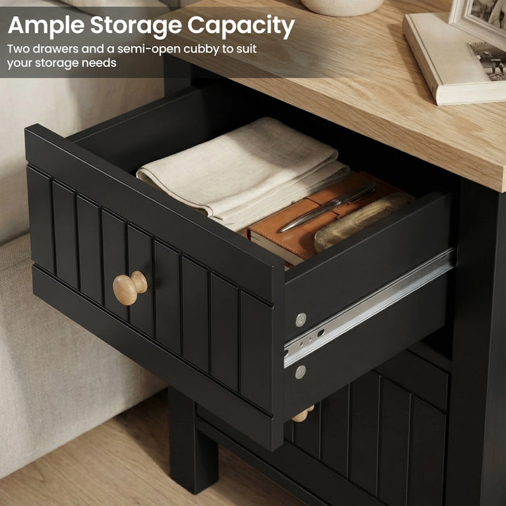 [Black] Two-drawer Linra bedside table demonstrating storage with the upper drawer extended on full runners