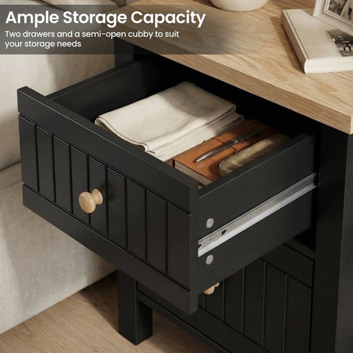 [Black] Two-drawer Linra bedside table demonstrating storage with the upper drawer extended on full runners