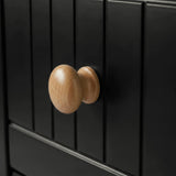 [Black] Linra chest of drawers handle close-up showing turned oak knob against vertical beaded panel