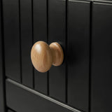 [Black] Linra chest of drawers handle close-up showing turned oak knob against vertical beaded panel