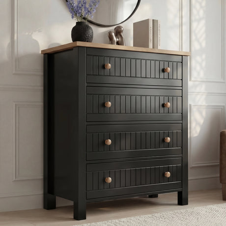 [Black] Linra 4-drawer chest main front view with vase and books on oak top and round mirror on wall above