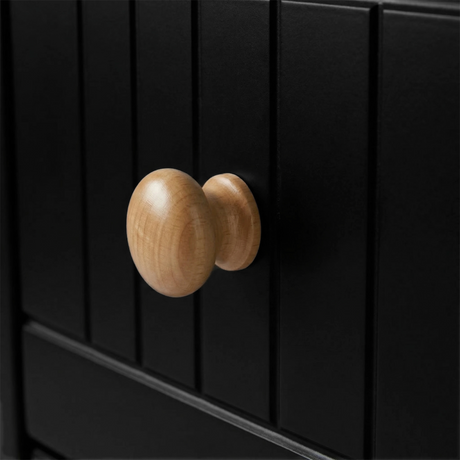 [Black] Linra 4-drawer chest close-up of round solid oak knob handle on a beaded panel painted drawer front