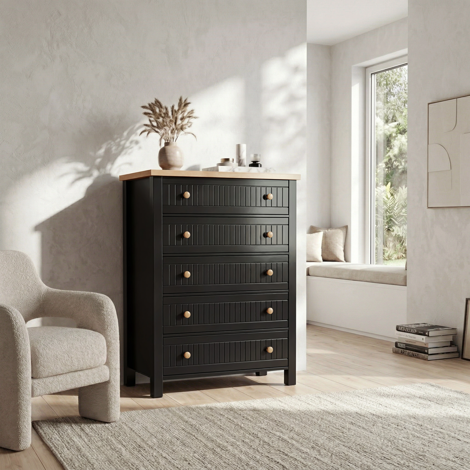 [Black] Linra tall chest of drawers in lifestyle bedroom shot with vase, lamp and books styled on oak top