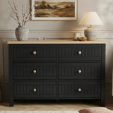 [Black] Linra 6-drawer chest front view in a styled room with neutral wall, lamp and artwork on the wall above