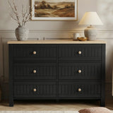 [Black] Linra 6-drawer chest front view in a styled room with neutral wall, lamp and artwork on the wall above