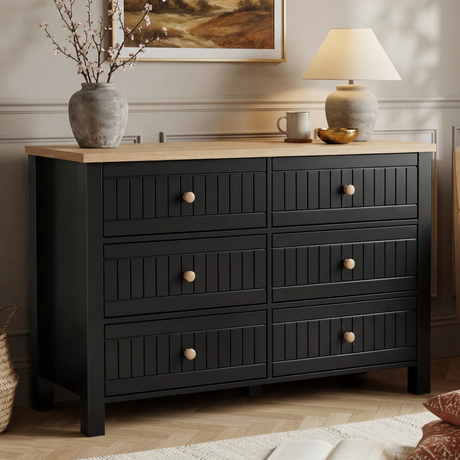 [Black] Linra 6-drawer chest main front view with vase and lamp on oak top and framed artwork on the wall above