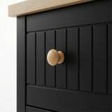 [Black] Linra 6-drawer chest close-up of round solid oak knob handle on a beaded panel painted drawer front